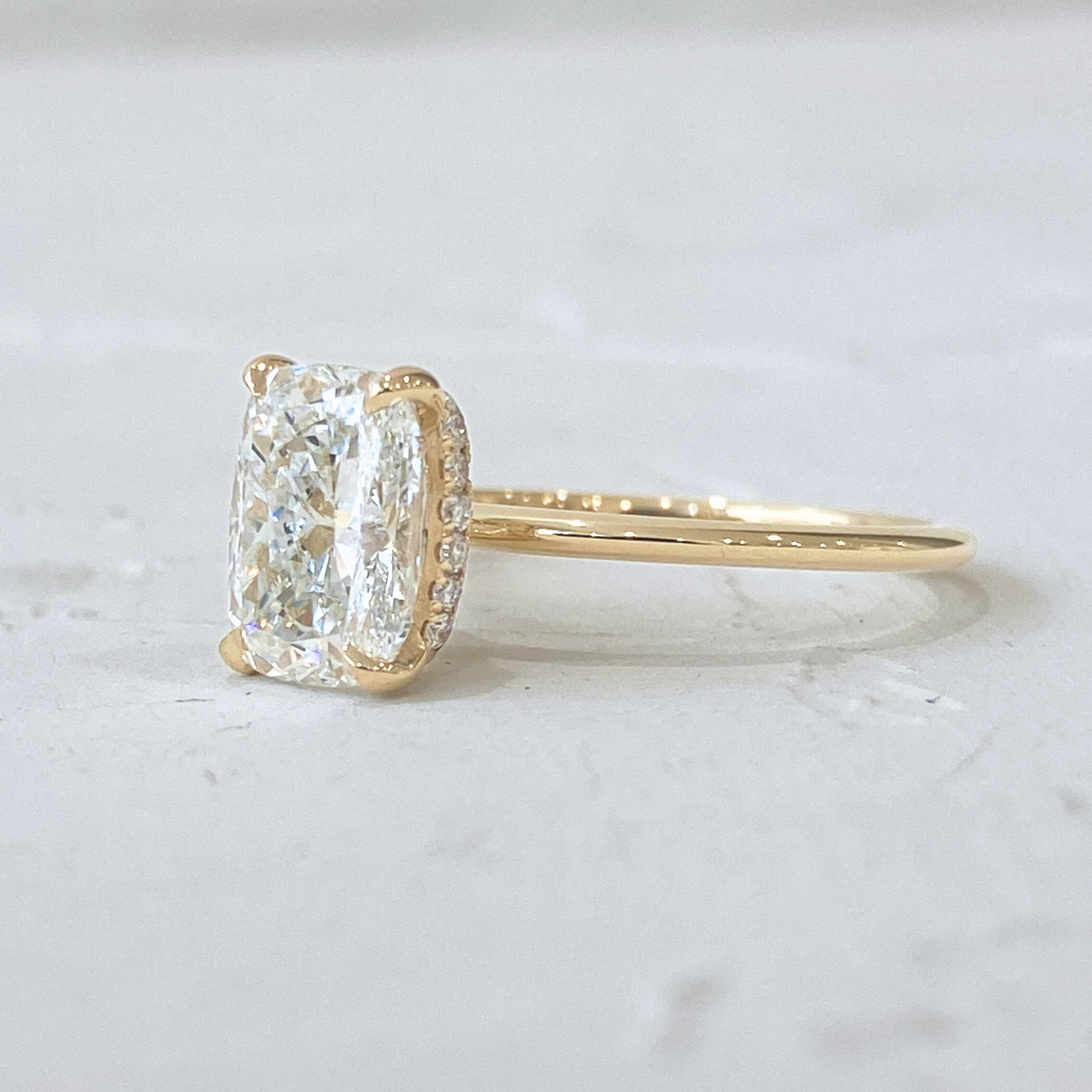 Rose | Elongated Cushion cut Solitaire Engagement Ring with a Subtle Diamond Wrap