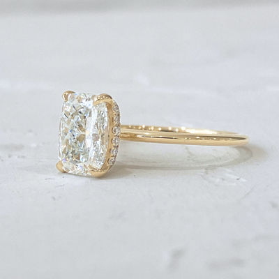 Rose | Elongated Cushion cut Solitaire Engagement Ring with a Subtle Diamond Wrap