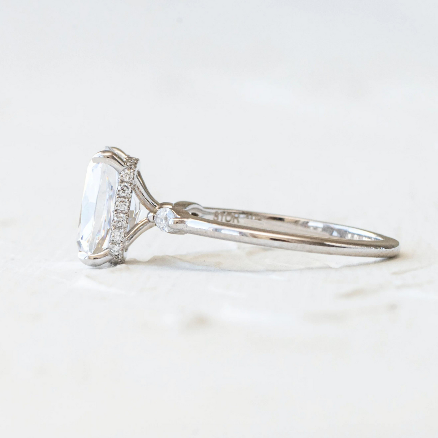 Ash | Raised Centre Stone with Marquise side details and Hidden Diamond Wrap