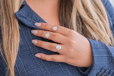 Em | Pear Cut Side Diamonds in Three Stone Engagement Ring